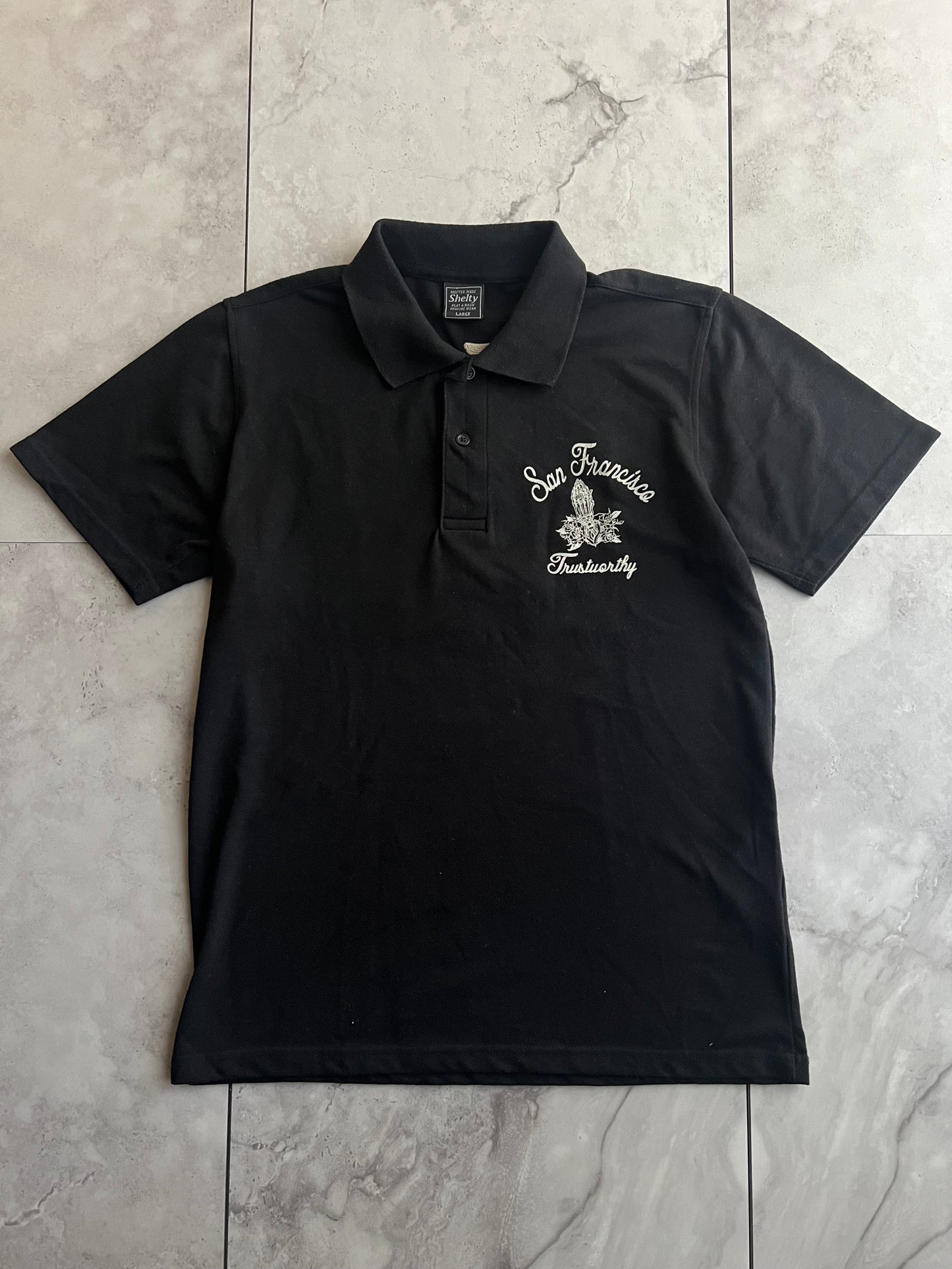 Shelty “Trustworthy” Embroidered Polo Tee